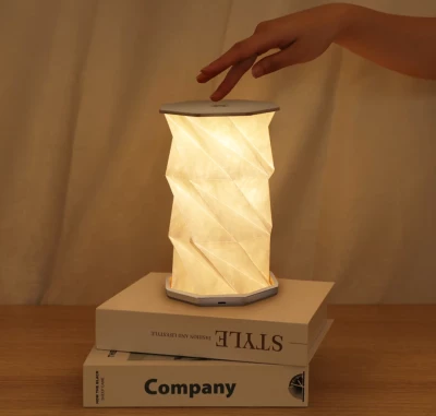 Rotating folding lamp