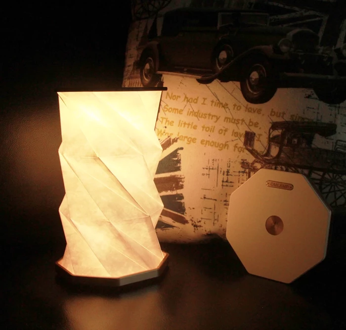 Rotating folding lamp